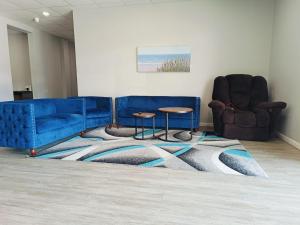 Posezení v ubytování Champion Inn Motel By OYO Hwy 59 Shepherd + 37 fotografií
