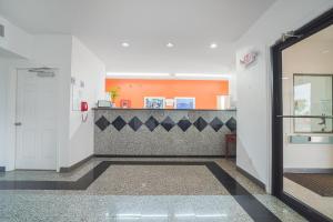 an empty hallway with a counter in a building at Island Inn By OYO Galveston Beach, TX in Galveston
