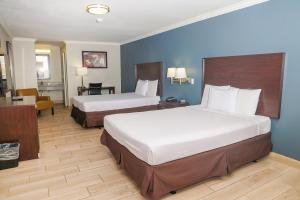 Postel nebo postele na pokoji v ubytování OYO Hotel McAllen Airport South