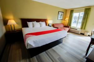 Ένα ή περισσότερα κρεβάτια σε δωμάτιο στο Cypress Inn & Suites Washington by OYO