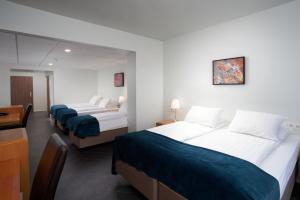 Una cama o camas en una habitación de Hotel Örk