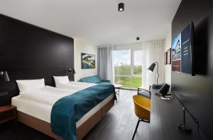 Una cama o camas en una habitación de Hotel Örk