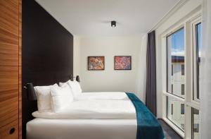 Una cama o camas en una habitación de Hotel Örk