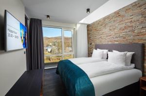 Una cama o camas en una habitación de Hotel Örk