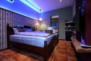 Katil atau katil-katil dalam bilik di Jasmine Orange B&B