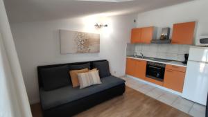 Kuchyňa alebo kuchynka v ubytovaní Apartments Kapetanovi Dvori