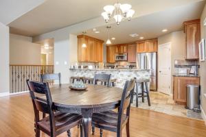 a kitchen and dining room with a wooden table and chairs at 6 Mi to Water Spacious Canyon Lake Home in Canyon Lake