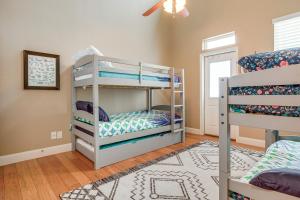 a room with two bunk beds and a rug at 6 Mi to Water Spacious Canyon Lake Home in Canyon Lake