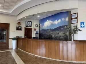 a waiting area with a large screen in a hospital lobby at Hotel Sierra de Quesada SL in Quesada