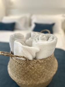 a basket with towels in it on a table at Pirandello 181 in Palermo +26 photos