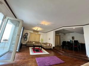 a living room with a couch and a table at Aqua Maadi Degla Group 199 in Cairo