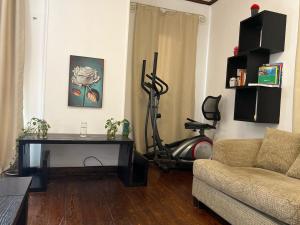 a living room with a couch and a vacuum at Aqua Maadi Degla Group 199 in Cairo