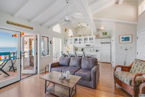a living room with a couch and a table at H180 - Hamilton Cove Villa 1-80 in Avalon