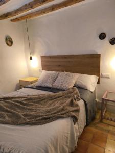 Postel nebo postele na pokoji v ubytování Ca la Tia Angelita + 9 fotografií