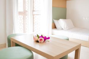 a room with a table with flowers on it at Nayah Stays, Amazing villa with private pool & 5 master suites in Hurghada +34 photos