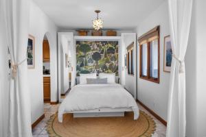 a bedroom with a bed and a rug at H228 - Hamilton Cove Villa 2-28 in Avalon