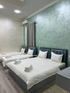 Ένα ή περισσότερα κρεβάτια σε δωμάτιο στο Sumaya Inn Hotel