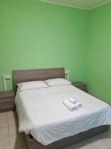A bed or beds in a room at Appartamento Via Bixio