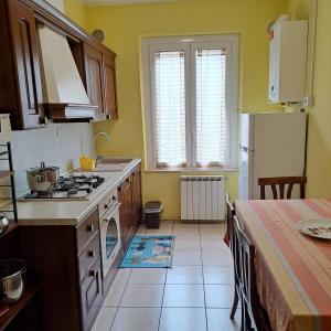 A kitchen or kitchenette at Appartamento Via Bixio