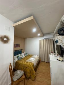 A bed or beds in a room at ORTIGIA 26