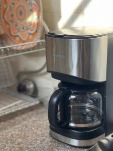 a coffee pot sitting on top of a counter at city zeze kinondoni in Dar es Salaam