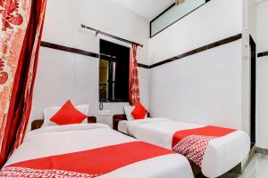 Postel nebo postele na pokoji v ubytování OYO Hotel Dreamland