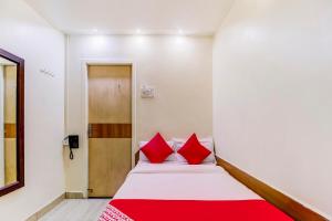 Postel nebo postele na pokoji v ubytování OYO Hotel Dreamland