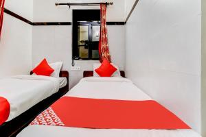 Postel nebo postele na pokoji v ubytování OYO Hotel Dreamland
