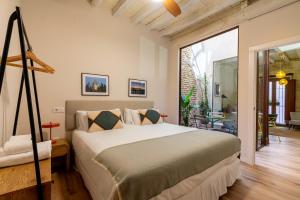 Ένα ή περισσότερα κρεβάτια σε δωμάτιο στο One&Lux Casa Barrabas