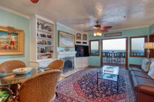 a living room with a couch and a table at H249 - Hamilton Cove Villa 2-49 in Avalon