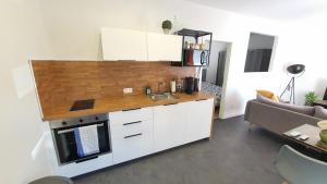 Η κουζίνα ή μικρή κουζίνα στο Cozy and chic apartment +6 φωτογραφίες
