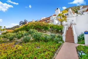 a house with a staircase leading up to it at H412 - Hamilton Cove Villa 4-12 in Avalon