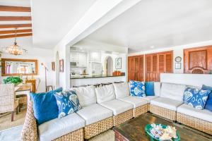a living room with a white couch and a table at H412 - Hamilton Cove Villa 4-12 in Avalon +22 photos