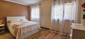 Ένα ή περισσότερα κρεβάτια σε δωμάτιο στο Calma en la Laguna