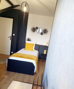 Postel nebo postele na pokoji v ubytování L'Orée des Champs