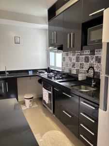 Kuchyň nebo kuchyňský kout v ubytování Apartamento Manaus Aeroporto