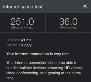 a screenshot of a cell phone screen with a speed test at W118 NEW! Central Canmore- Light Industrial Hotel Room in Canmore