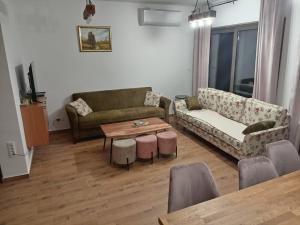 a living room with a couch and a table at La Casa Sofija in Nemenikuće