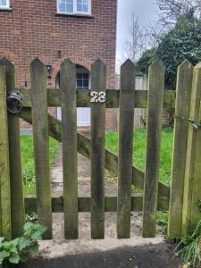 a wooden fence with the number on it at 28 Clifford Road in Whitstable