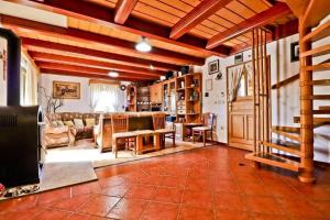 a living room with a couch and a table at House Grga in Gornja Voća