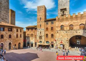 a view of the medieval city of san gimignano at Il mare negli occhi in Marina di Pisa