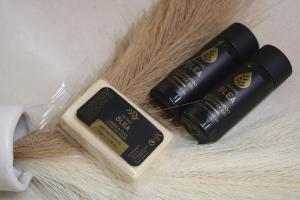 two bottles of hair products sitting on a table at Luaz Naxian living in Naxos Chora