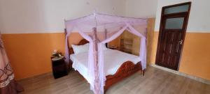 Krevet ili kreveti u jedinici u okviru objekta Kamengo Cottages