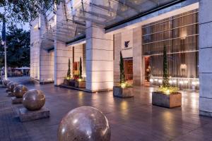 a building with a bunch of metal spheres in front of it at JW Marriott Hotel Bogotá in Bogotá