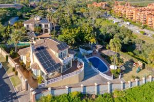 an aerial view of a house with solar panels on its roof at Luxury Villa - Casa Bosqueverde in Marbella