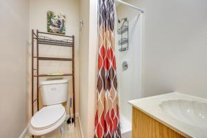a bathroom with a toilet and a shower at 2 Mi to Dtwn Home with Game Room in St Augustine! in Saint Augustine +23 photos