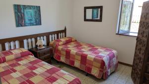 Ένα ή περισσότερα κρεβάτια σε δωμάτιο στο Casa Julián
