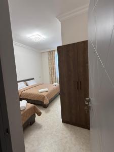 Ένα ή περισσότερα κρεβάτια σε δωμάτιο στο Guest House MD