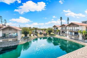 an image of a swimming pool at a resort at Lake House at the Beach C207 by Beachside Management in Siesta Key