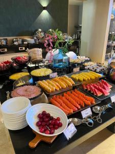 a buffet filled with lots of different types of food at Holiday Inn Bogota Airport by IHG in Bogotá
